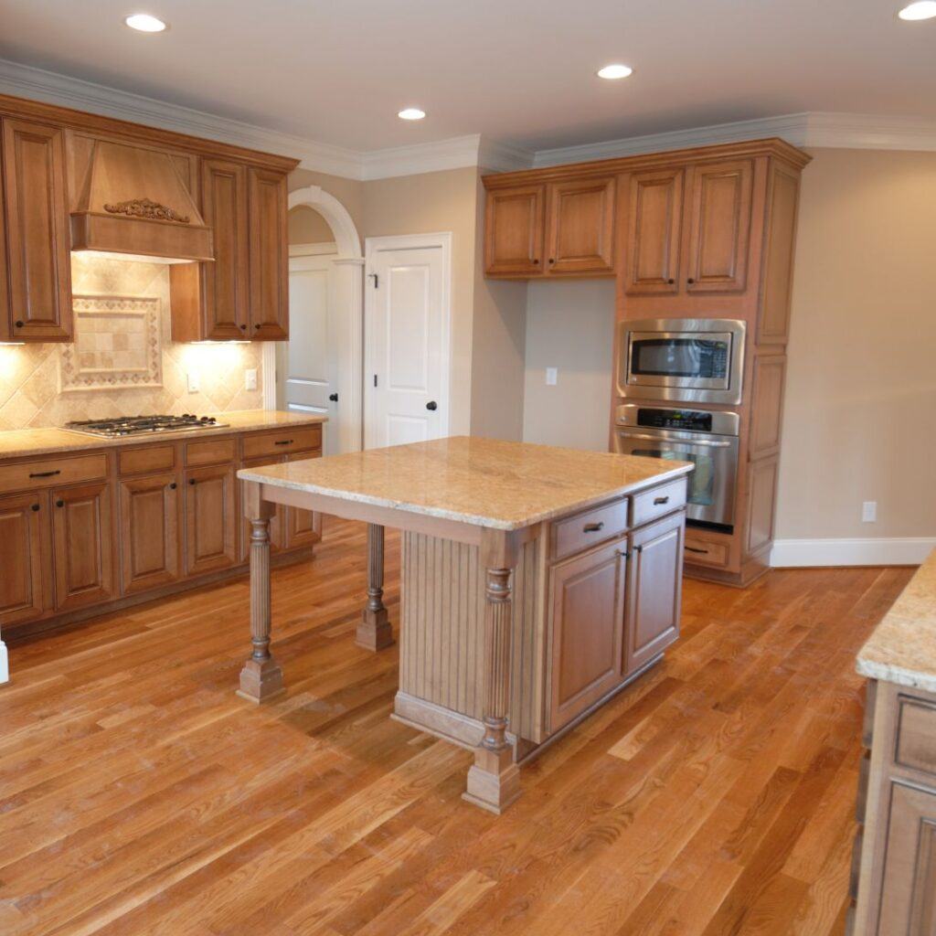 Kitchen with honey-toned hardwood floor