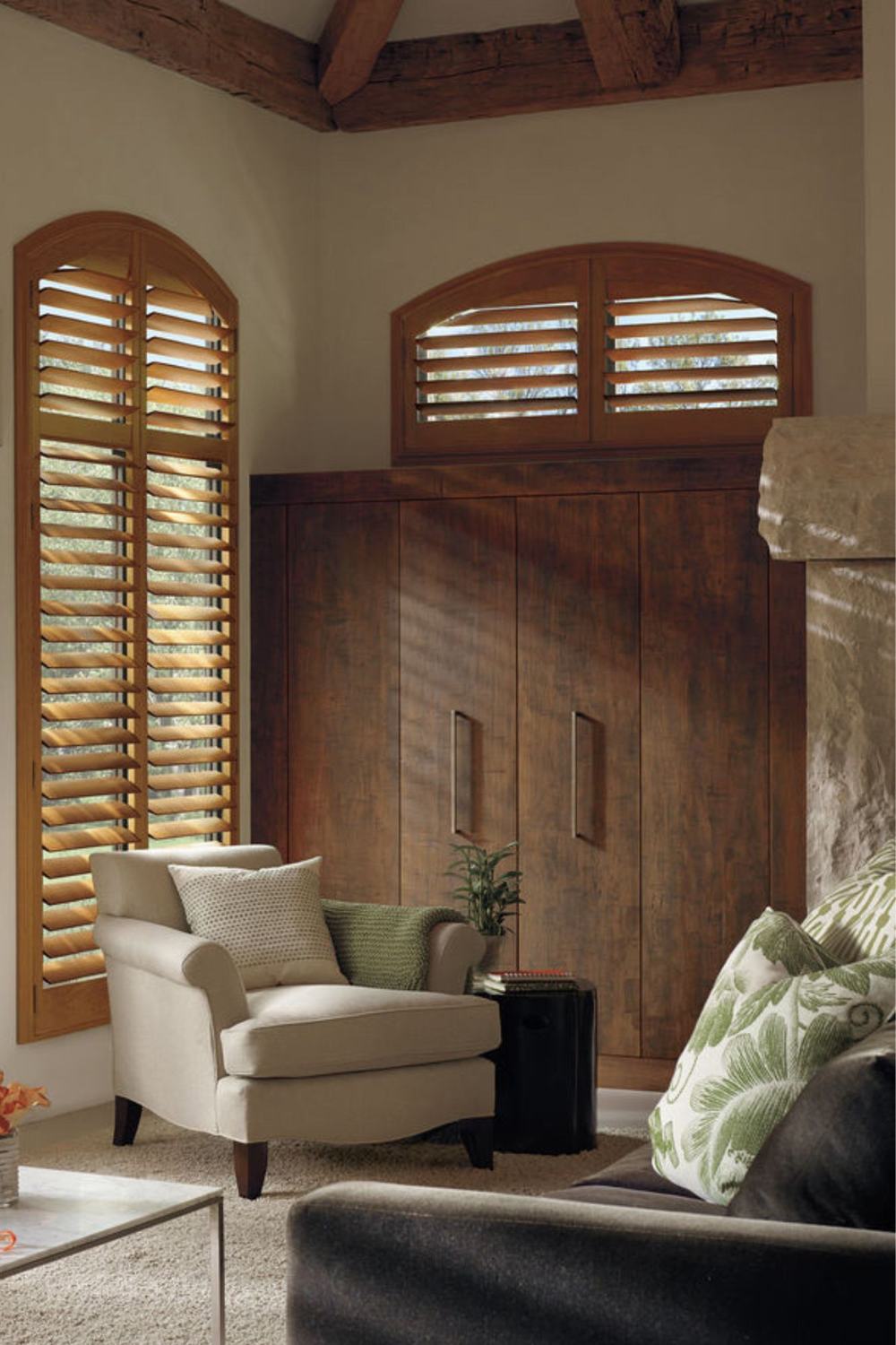 Living room with arched plantation shutters